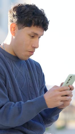 Young man reacting to smartphone content in split screen. Vertical