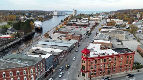 drone flying towards the intersection of small ontario town in georgian bay