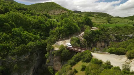 aerial zoom-in shot of a metal bridge in the osum gorge in albania