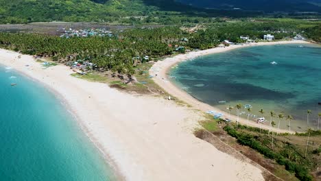 Revelación-Aérea-Cinematográfica-De-La-Playa-Doble-En-La-Playa-De-Nacpan,-El-Nido,-Palawan,-Filipinas