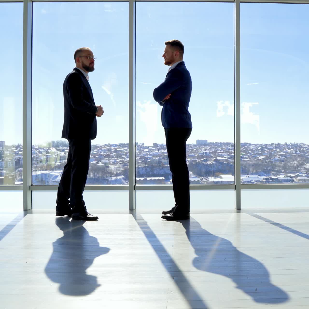 Businessman shadow near the window. Silhoutte of successful businessman