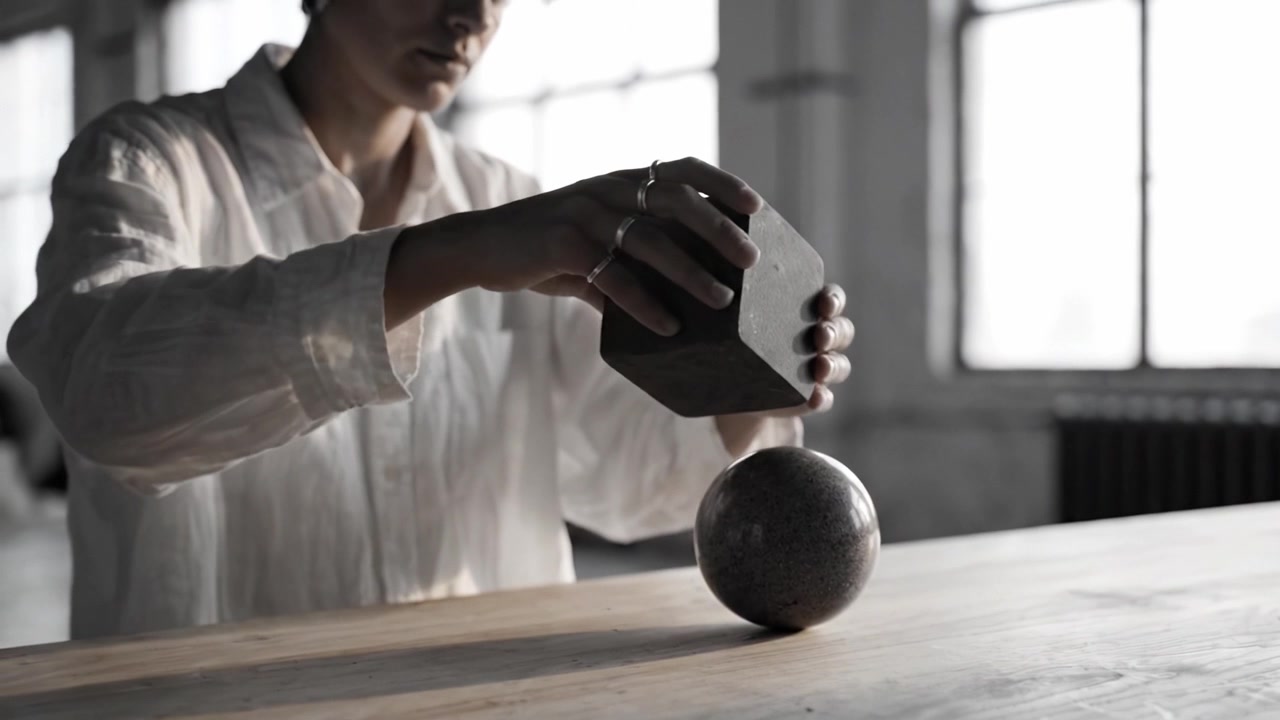 A Detailed Exploration of Geometric Forms: A Focus on Cube and Sphere Interactions in a Studio Setting with Natural Light