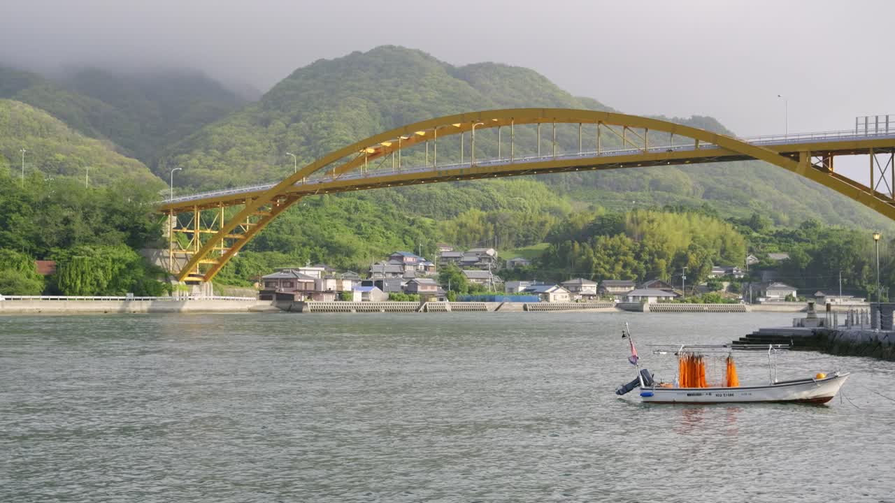 Calm island scenery on Japanese island with boat parked in harbor