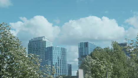 beautiful timelapse showing the skyline of tall buildings in the business district of amsterdam, located in the south of the city, also called wtc zuid