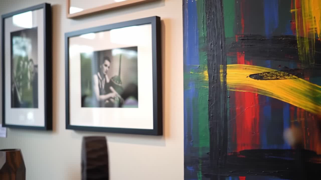 Artistic Display Featuring Framed Photos and Vibrant Abstract Painting in an Elegant Interior Setting