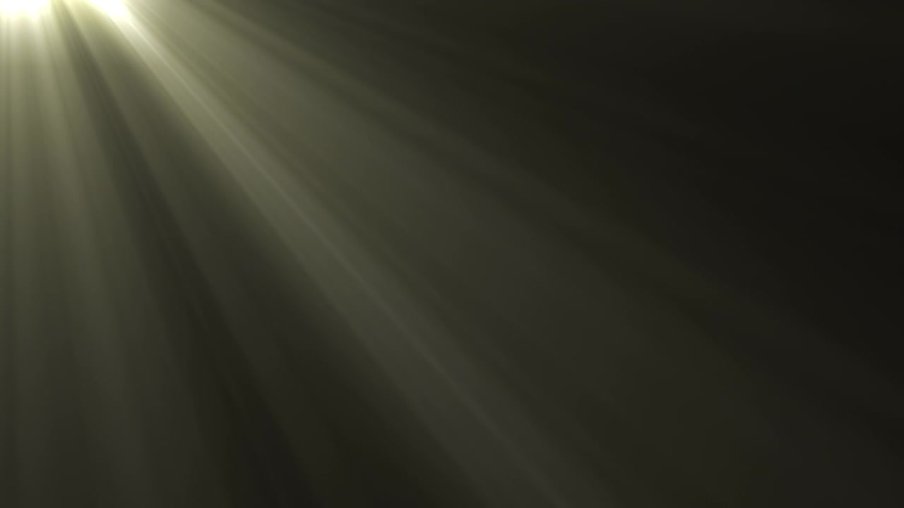 Soft Golden Light Rays Shining Through Dark Background