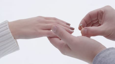 engagement ring on womans hand