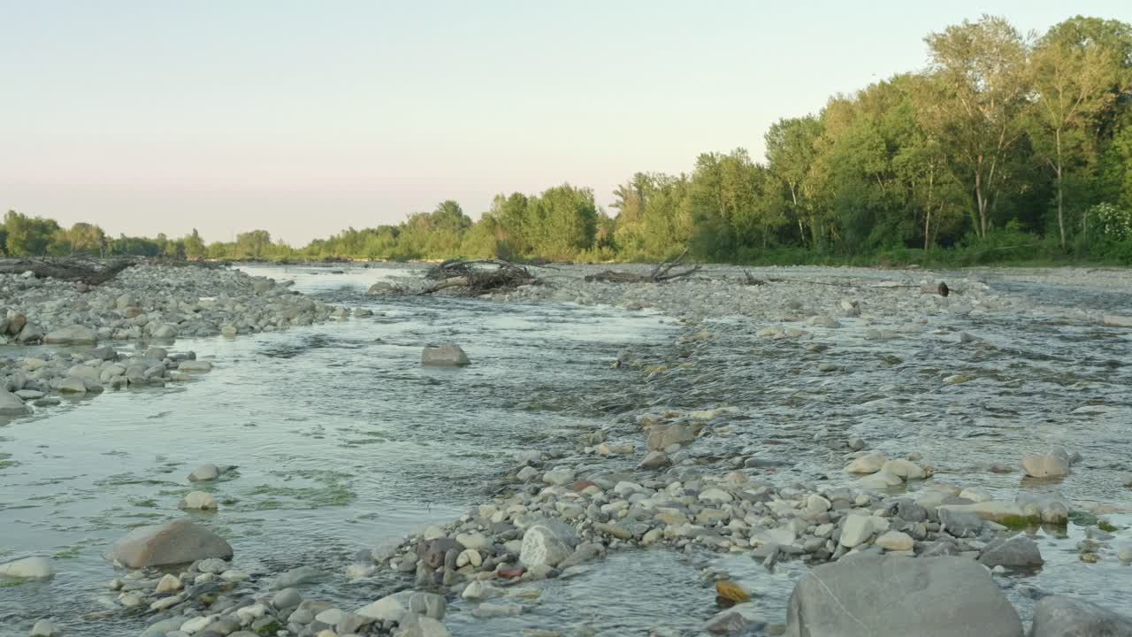Wide Rocky Riverbed With Clear Flowing Water