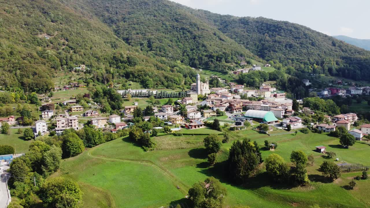 drone fly above historical village of Albino stretches along both sides of the Seriana valley floor European alps mountains landscape