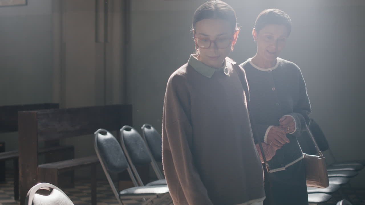 Three generations of women in a church