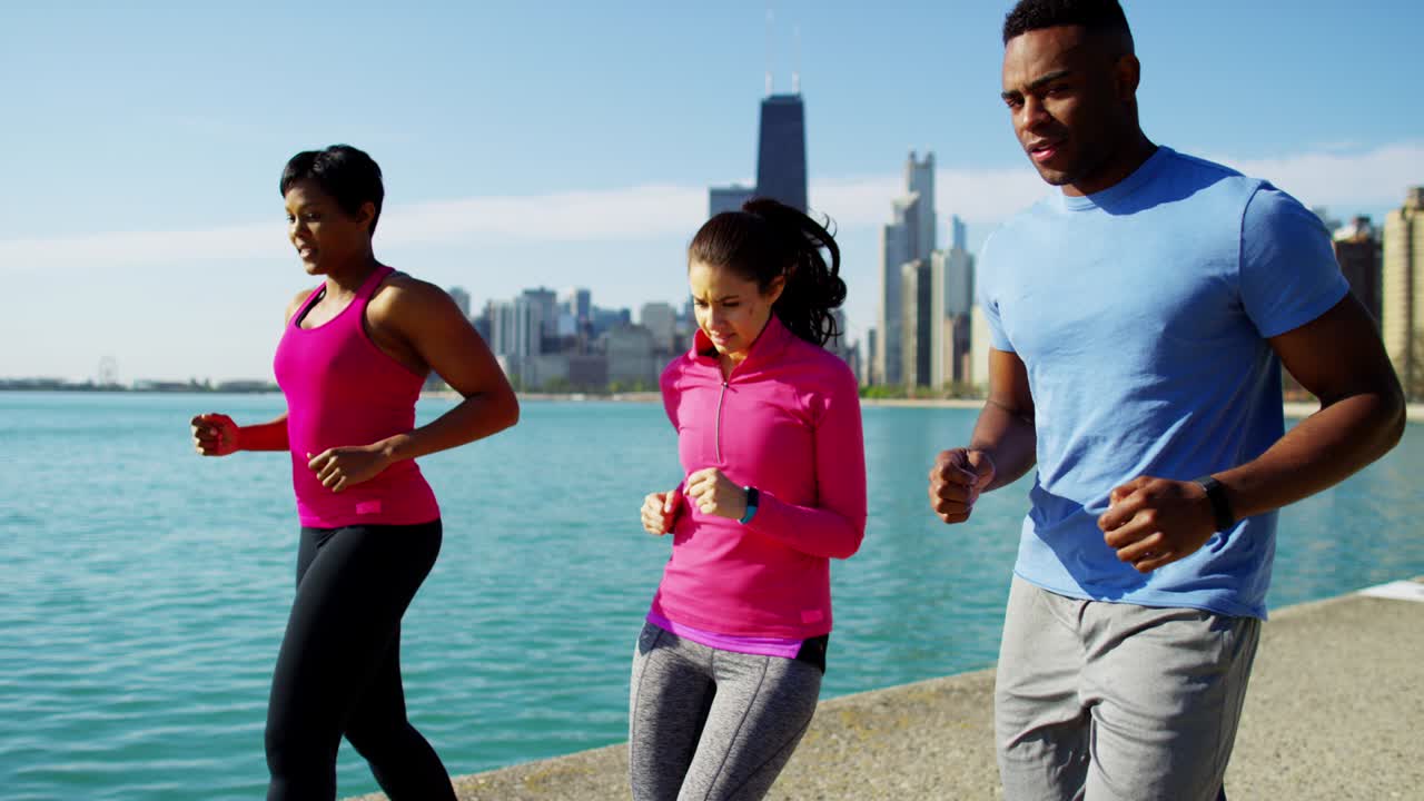 Multi Ethnic male and females running and stretching