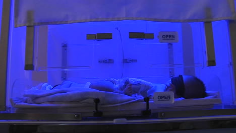 a baby in an incubator