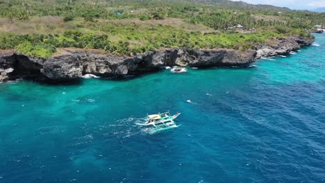 Passenger-sailboat-at-sun-sea-shore-closeup-aerial-view