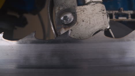 thin band saw moves through sharpening machine at plant