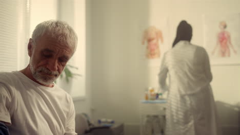 senior patient preparing get injection vaccine in doctor office close up.