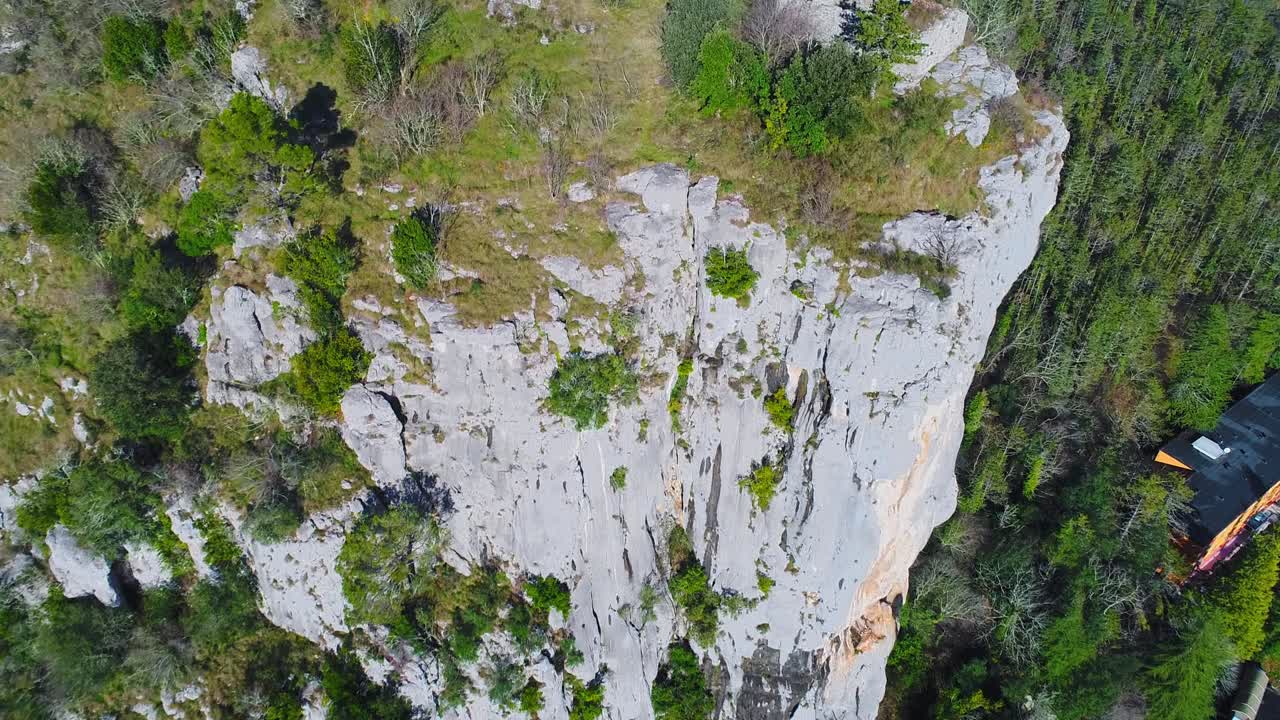 ruins of church and crosses on top of majestic cliffs, forest. Motovun, Croatia