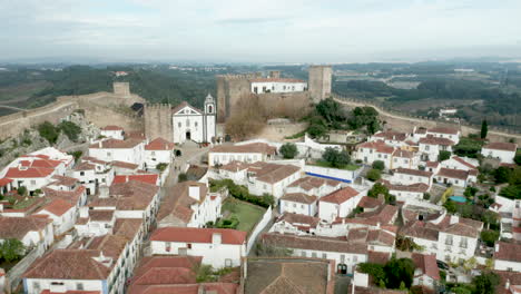 Panoramic-View-Of-The-Medieval-Town-Of-Obidos-In-Portugal---aerial-pullback