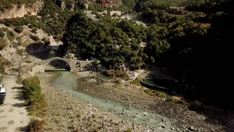 Drone-view-of-Benja-hot-springs-and-bridge,-Albania,-Balkans,-Europe