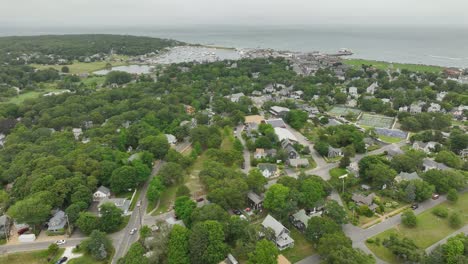 rising drone shot of a town on the coast of massachusetts