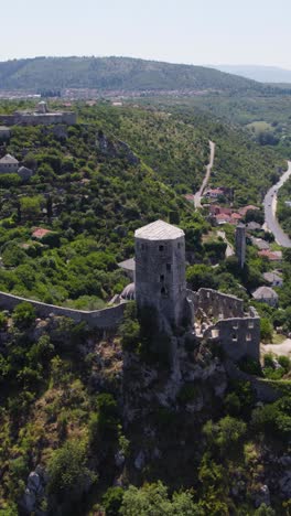 ancient citadel on hilltop in počitelj, bosnia, seen from above in summer sun
