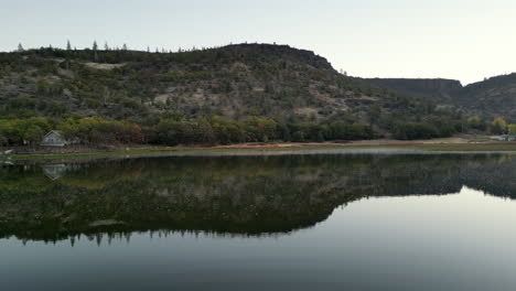 pan-up-over-lake-in-the-mountains