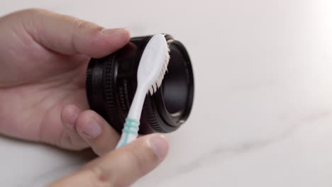 how to clean your camera lens with a toothbrush