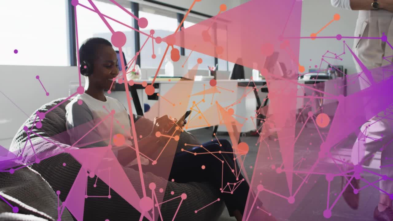 Mid-adult woman tapping smartphone and activating growing network overlay for marketing in office