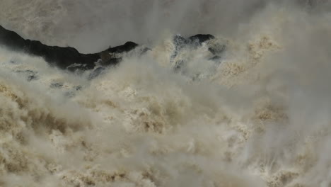 Close-up-of-water-rushing-down-Barron-Falls-Waterfall-in-Far-North-Queensland-during-wet-season