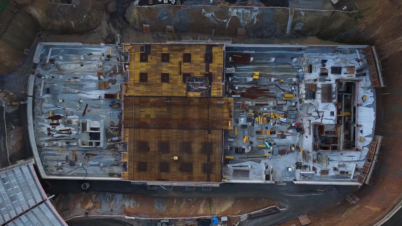 Drone shot of huge construction site in Gaia city. Porto subway line building site. Drone flying upward.