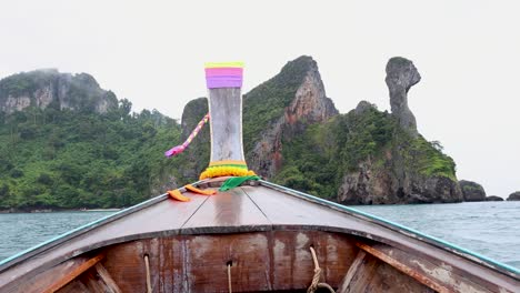 tour boat navigating krabi's stunning coastal landscape