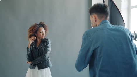 fashion photoshoot in a studio with a model and a photographer