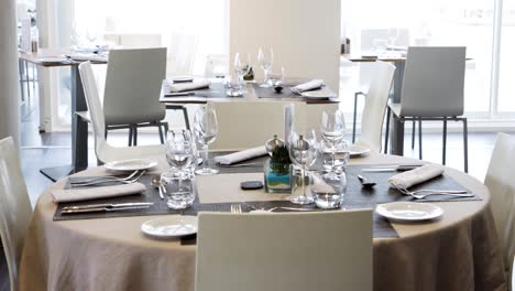 slow revealing shot of a table set out for dinner service at a spa in france