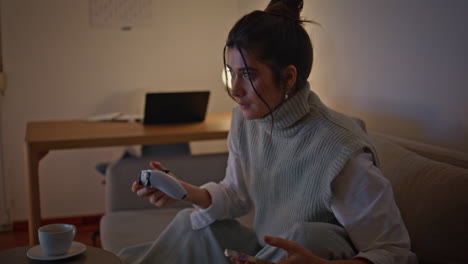 playing woman trying win game at night home closeup. girl checking smartphone