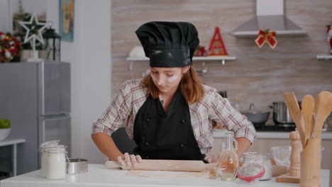 grandchild celebrating christmas holiday preparing traditional homemade dough