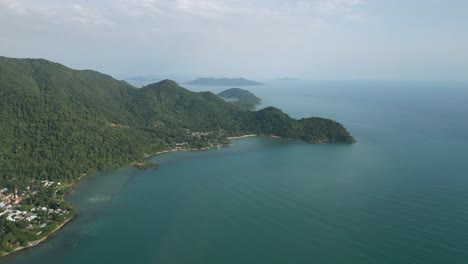 aerial scenic nature drone footage of the mountains and beaches on the tropical island of koh chang in thailand during sunset