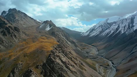 serene nature scenery, mountainous valley pass, cinematic aerial view
