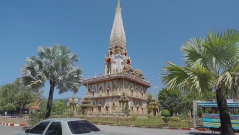 buddhist famous landmark pagoda at wat chalong phuket, thailand. pov camera