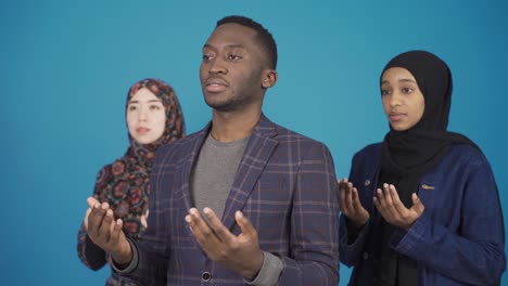 muslim people of many different races pray.