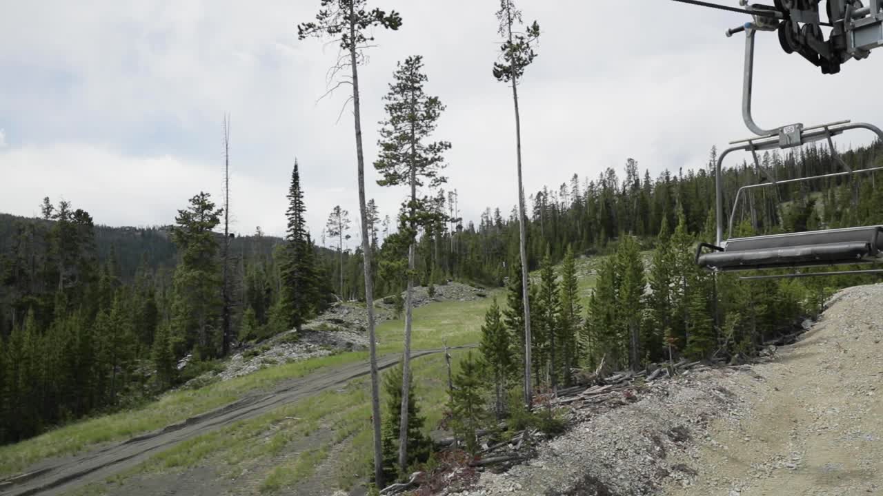 Riding the chairlift at a resort for downhill mountain biking