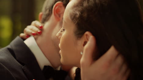 Fancy-bride-and-groom-posing-before-wedding-in-park.-Couple-hugging-outdoors