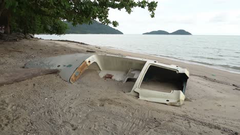 demolished boat at beach