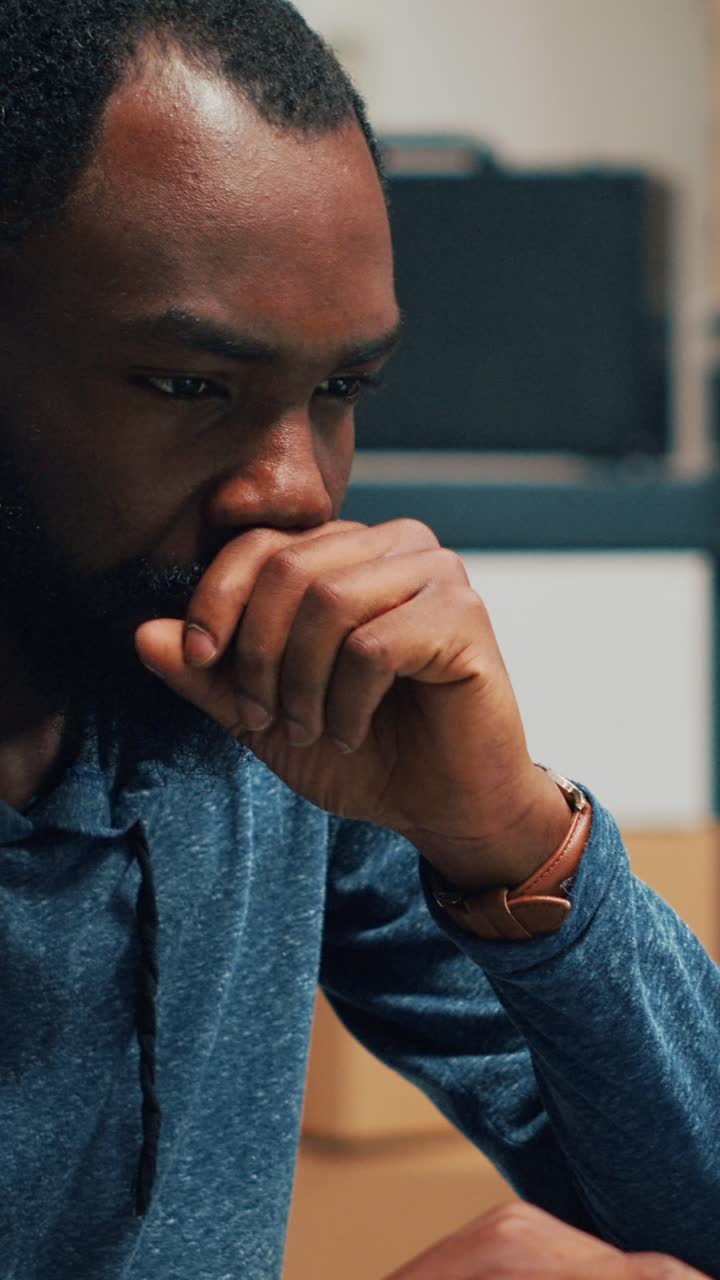 Vertical video: Male business owner analyzing supply chain and logistics to work on retail selling