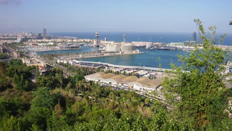 views of the city and port of barcelona from montjuic hills in barcelona, spain