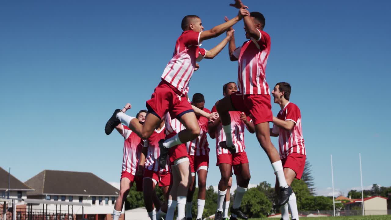 Rugby players celebrating on the field