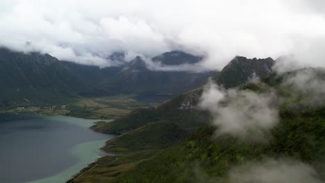 Flying-to-the-clouds-and-mountains-in-Lofoten,-Norway