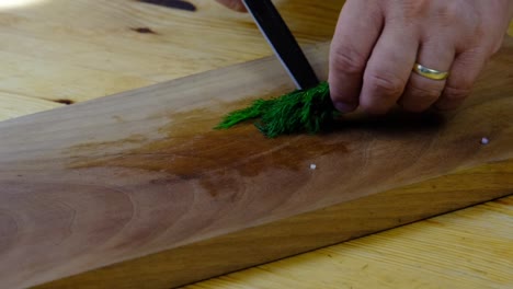 the chef chopping the parsley