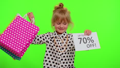 Kid-child-girl-showing-shopping-bags-and-Up-To-70-Percent-Off-inscriptions-banner-text,-Black-Friday