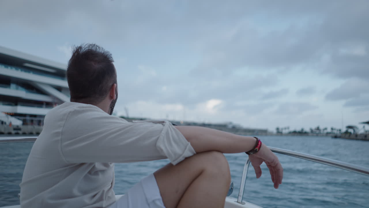 Man on a boat enjoying the view of the sea