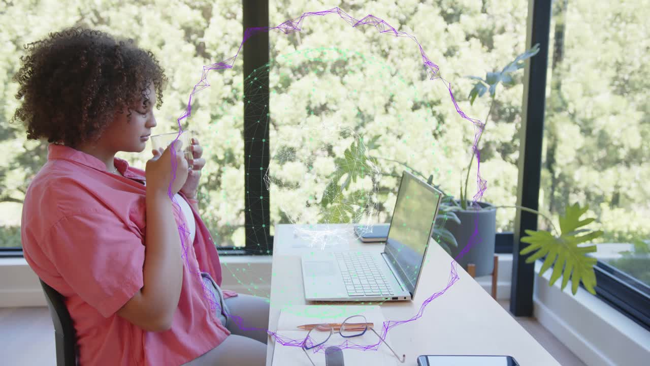 Woman typing laptop causing pulsing ring around hands torso pausing and sipping mug resuming work