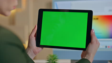 businesswoman watching tablet greenscreen at creative workplace close up.